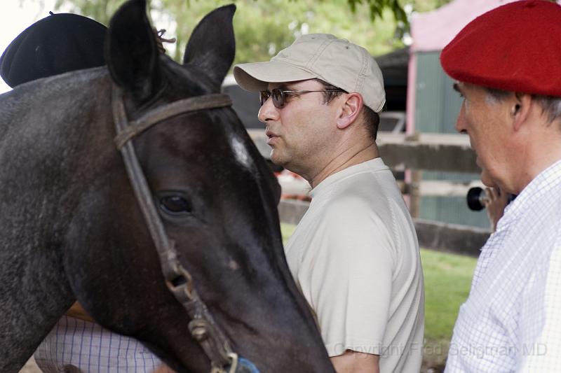 20071202_150004  D200 3900x2600.jpg - Murray Dalfen, from Montreal, a guest at the Estancia, checks his horse